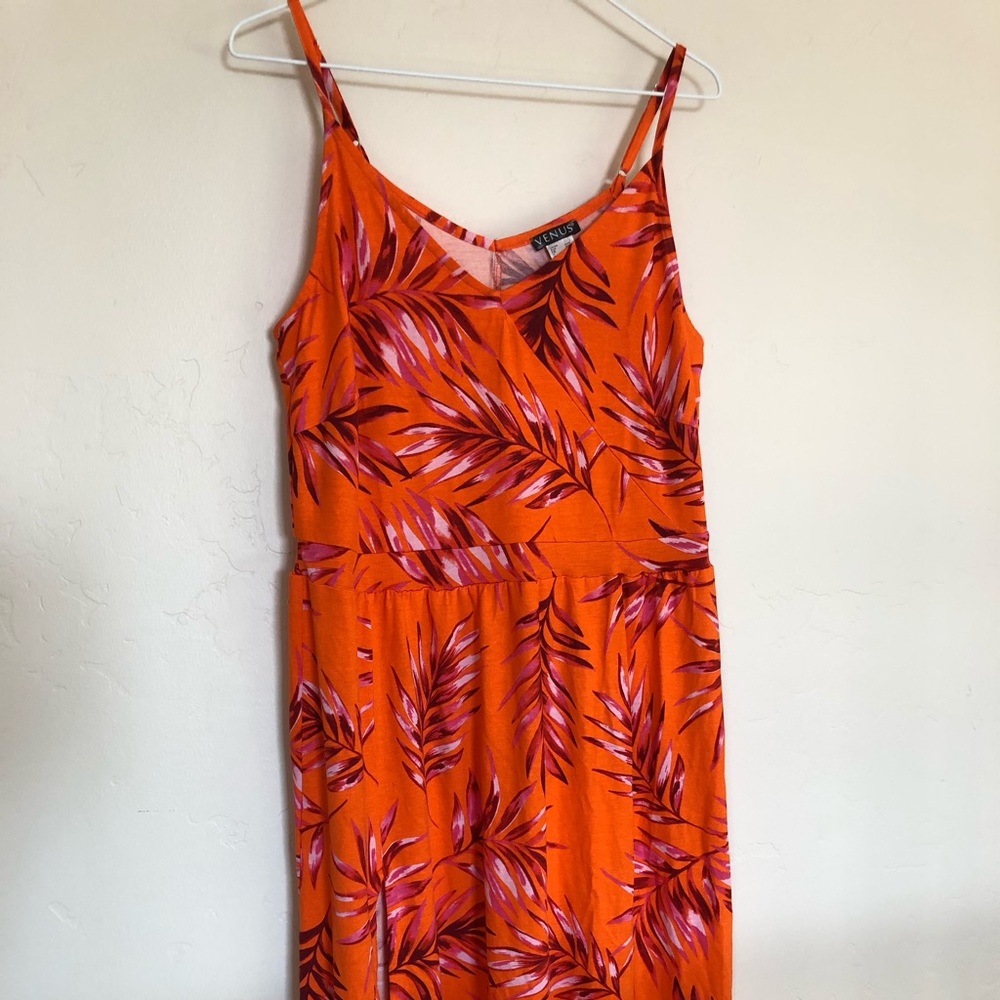 Brand new never worn size large orange asymmetrical midi dress with leg slit